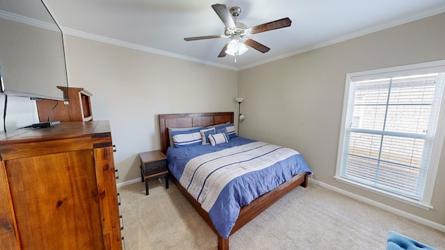 carpeted bedroom with crown molding and ceiling fan