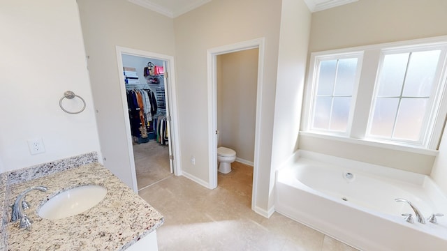 bathroom featuring ornamental molding, toilet, a bathtub, and plenty of natural light