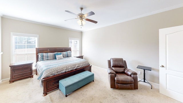 bedroom featuring ornamental molding, light colored carpet, and ceiling fan