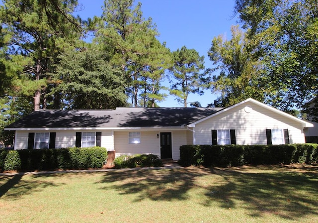 ranch-style house with a front lawn