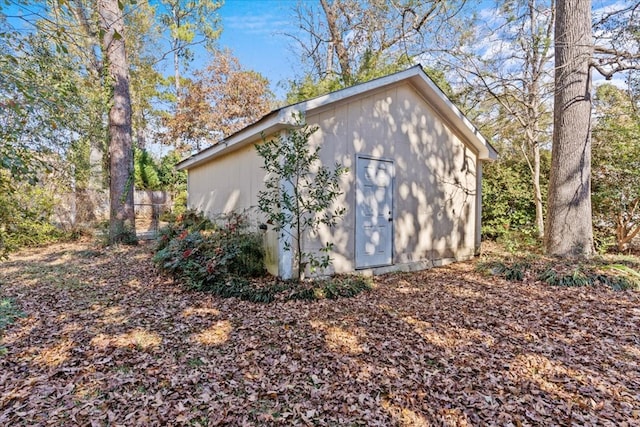 view of property exterior with an outdoor structure