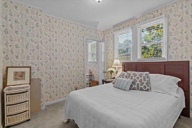 carpeted bedroom with a textured ceiling and ornamental molding