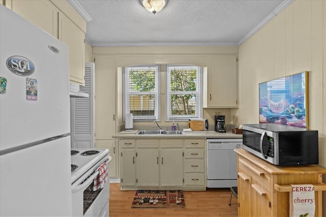 kitchen with a textured ceiling, white appliances, crown molding, sink, and light hardwood / wood-style flooring