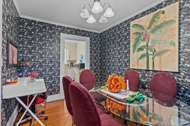 office area featuring a textured ceiling, hardwood / wood-style flooring, and crown molding