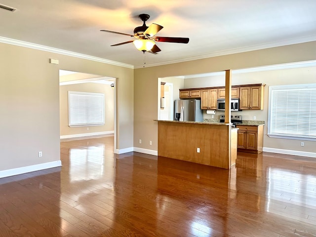 kitchen featuring visible vents, brown cabinets, ornamental molding, dark wood-style floors, and appliances with stainless steel finishes