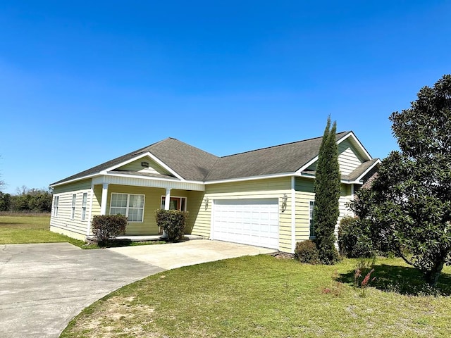 single story home featuring a garage, a porch, concrete driveway, and a front yard