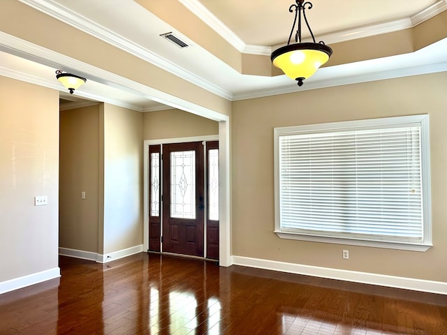 foyer entrance featuring crown molding, dark wood-style floors, visible vents, and baseboards