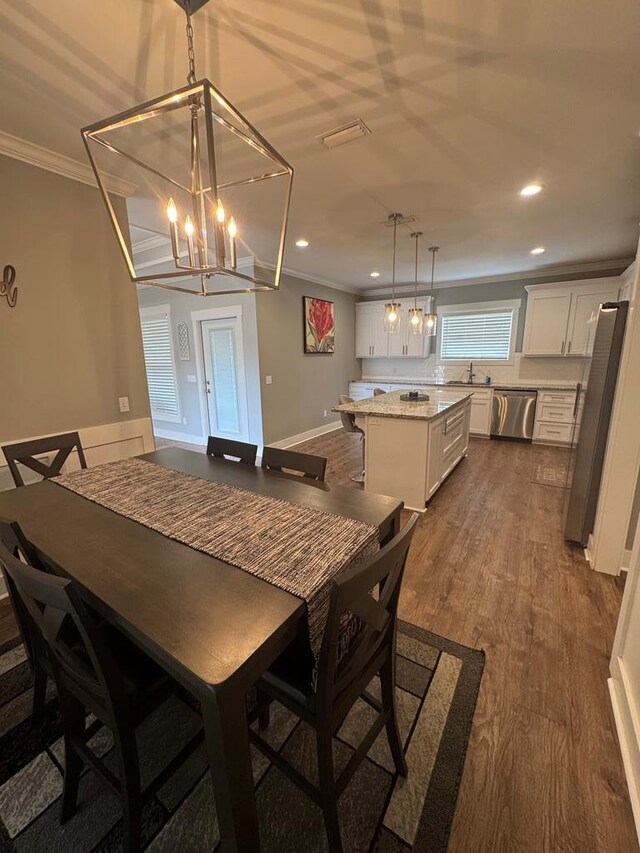 1180 Sandbed Rd, Newton, AL 36352 - dining space featuring ornamental molding, a chandelier, recessed lighting, and dark wood-style floors
