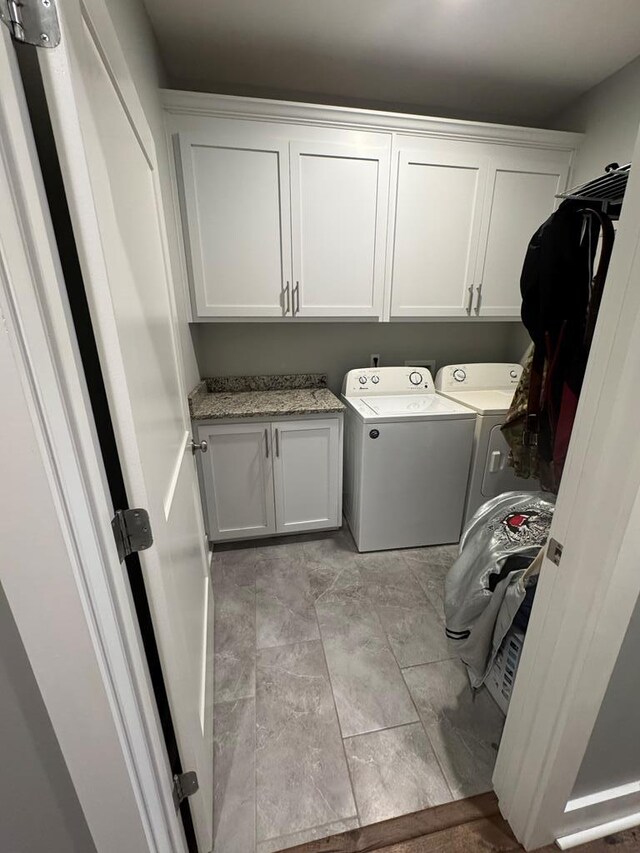 1180 Sandbed Rd, Newton, AL 36352 - washroom with cabinet space and washer and clothes dryer