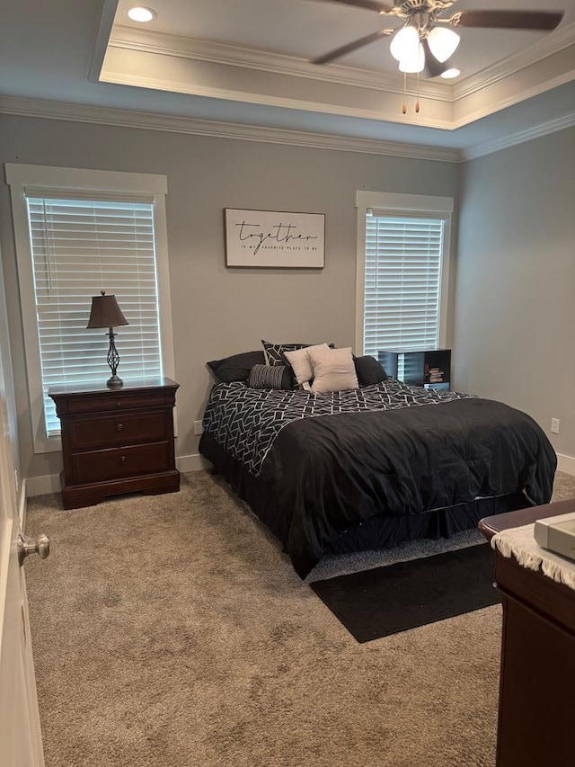 1180 Sandbed Rd, Newton, AL 36352 - carpeted bedroom with a tray ceiling, crown molding, baseboards, and a ceiling fan