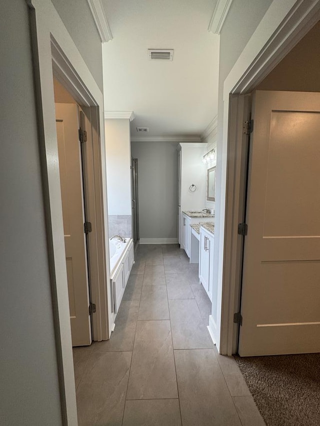 1180 Sandbed Rd, Newton, AL 36352 - full bath with crown molding, vanity, a garden tub, tile patterned flooring, and baseboards