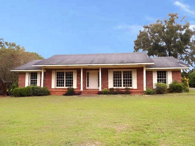 ranch-style home with a front lawn