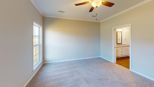 unfurnished bedroom with ceiling fan, ornamental molding, connected bathroom, and multiple windows