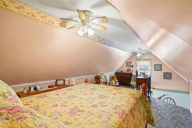 bedroom with vaulted ceiling and a ceiling fan