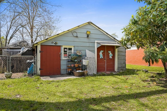 view of shed featuring fence