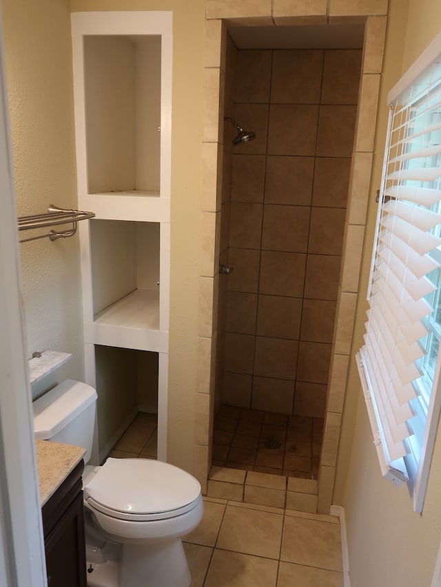 1103 Sassar St, Dothan, AL 36301 - full bath featuring a stall shower, toilet, vanity, and tile patterned floors