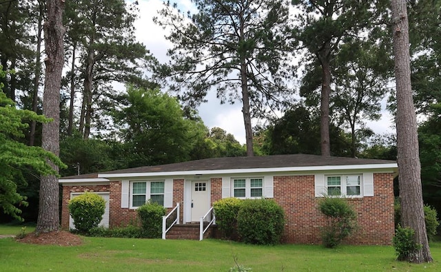 1103 Sassar St, Dothan, AL 36301 - ranch-style house with brick siding, a front yard, and a garage
