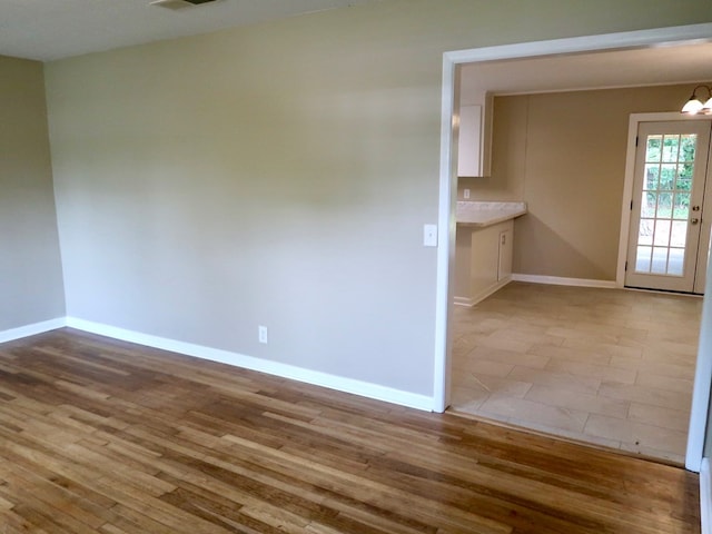 1103 Sassar St, Dothan, AL 36301 - spare room featuring baseboards and wood finished floors