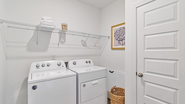 clothes washing area featuring washing machine and dryer