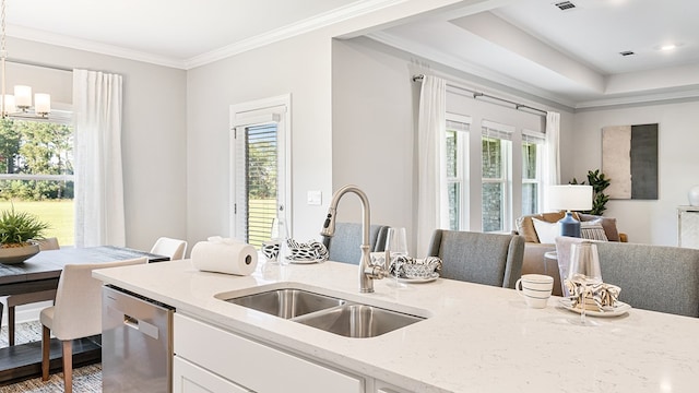 kitchen featuring stainless steel dishwasher, a healthy amount of sunlight, and sink