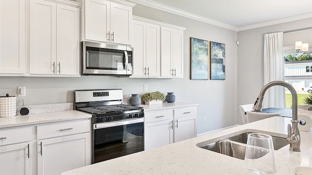 kitchen with light stone counters, stainless steel appliances, crown molding, sink, and white cabinets