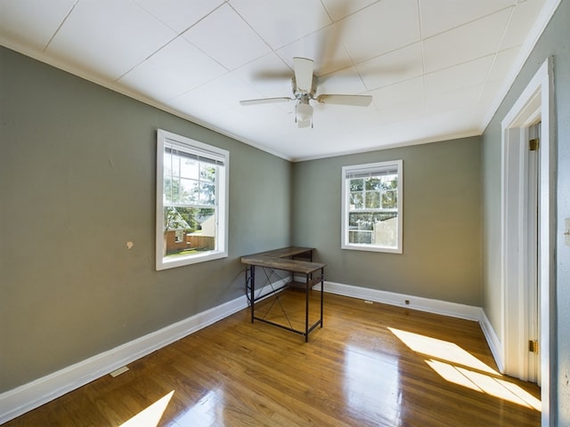 interior space with ceiling fan, light hardwood / wood-style floors, and ornamental molding