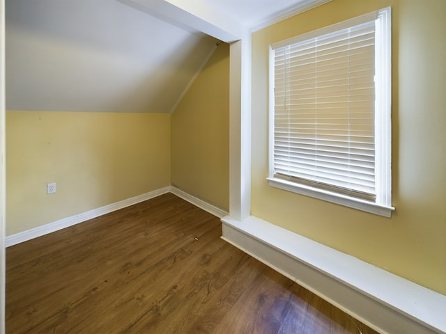 bonus room featuring dark hardwood / wood-style floors and lofted ceiling