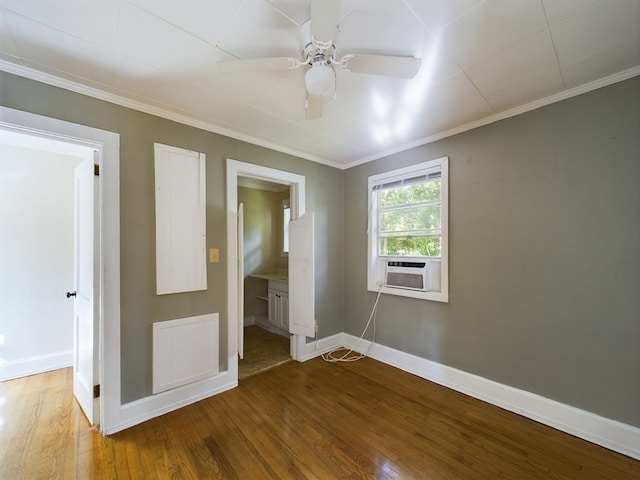 unfurnished bedroom with connected bathroom, ceiling fan, crown molding, hardwood / wood-style floors, and cooling unit