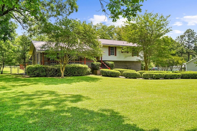 568 N Morris St, Slocomb, AL 36375 - view of front of home featuring brick siding and metal roof