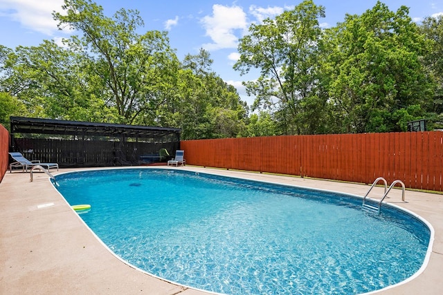 568 N Morris St, Slocomb, AL 36375 - view of swimming pool featuring a fenced backyard and view of wooded area