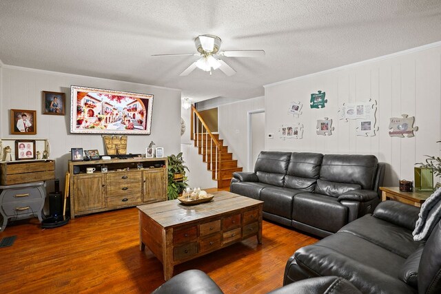 568 N Morris St, Slocomb, AL 36375 - living room with crown molding, ceiling fan, dark wood finished floors, stairway, and a textured ceiling