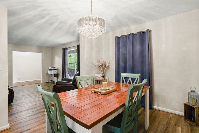 568 N Morris St, Slocomb, AL 36375 - dining room featuring a chandelier, wood finished floors, and baseboards