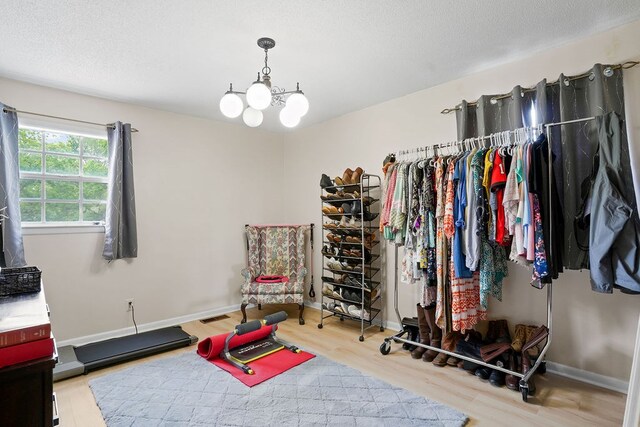 568 N Morris St, Slocomb, AL 36375 - walk in closet with wood finished floors and a chandelier