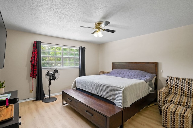 568 N Morris St, Slocomb, AL 36375 - bedroom featuring light wood-type flooring, a ceiling fan, and a textured ceiling