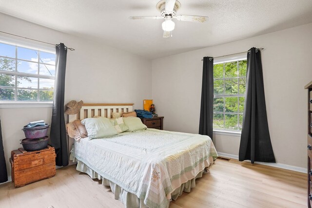 568 N Morris St, Slocomb, AL 36375 - bedroom featuring light wood-type flooring, a ceiling fan, and baseboards
