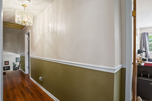 568 N Morris St, Slocomb, AL 36375 - corridor featuring a chandelier, wood finished floors, and baseboards
