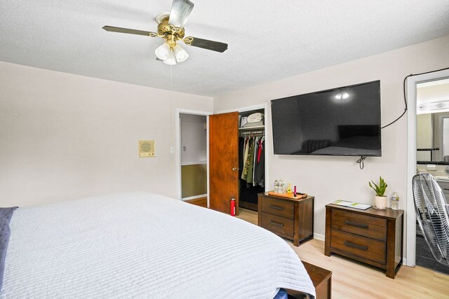 568 N Morris St, Slocomb, AL 36375 - bedroom featuring light wood-style flooring, a closet, a ceiling fan, and a textured ceiling