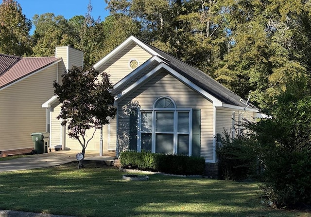 exterior space with a garage and a front yard