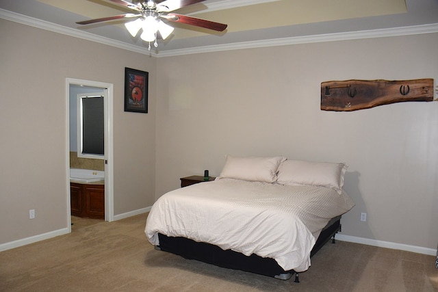 carpeted bedroom with ceiling fan, crown molding, and ensuite bath