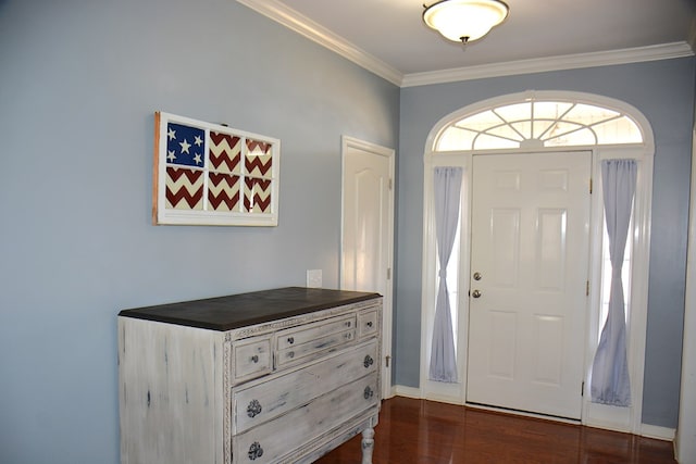 entrance foyer featuring dark hardwood / wood-style flooring and ornamental molding