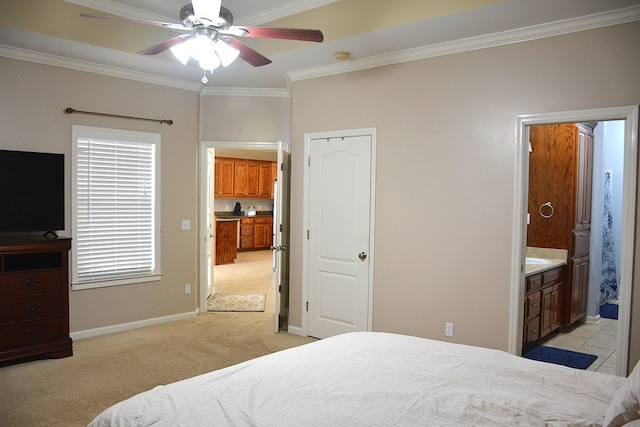 bedroom with ceiling fan, ornamental molding, light carpet, and connected bathroom