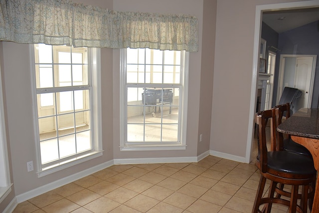 dining room featuring light tile patterned floors and a wealth of natural light