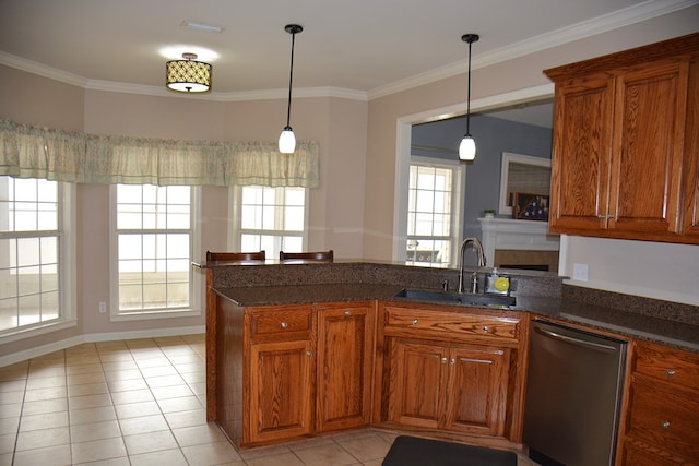 kitchen with kitchen peninsula, stainless steel dishwasher, plenty of natural light, and sink