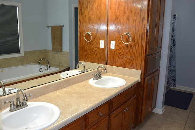 bathroom with vanity, a tub to relax in, and tile patterned floors