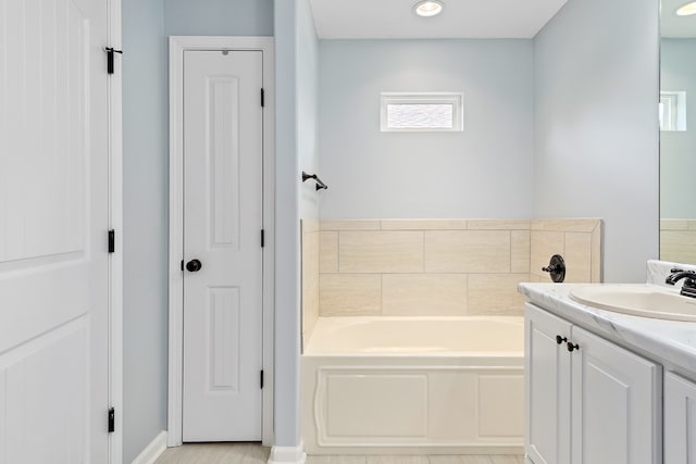 522 Birchwood Ln, Dothan, AL 36301 - bathroom featuring a garden tub, vanity, a closet, and baseboards
