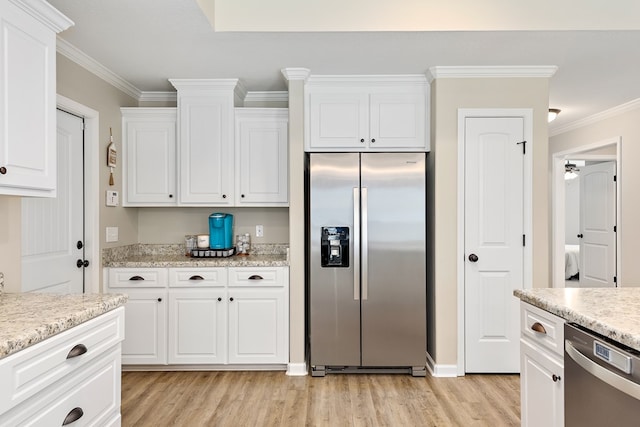 522 Birchwood Ln, Dothan, AL 36301 - kitchen featuring appliances with stainless steel finishes, light wood-style flooring, ornamental molding, and white cabinetry