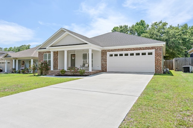 522 Birchwood Ln, Dothan, AL 36301 - view of front facade with cooling unit, a porch, an attached garage, brick siding, and concrete driveway