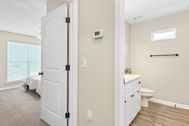 522 Birchwood Ln, Dothan, AL 36301 - bathroom featuring toilet, vanity, baseboards, and healthy amount of natural light