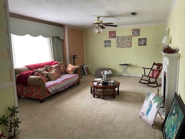 carpeted living room with ceiling fan, a textured ceiling, and ornamental molding