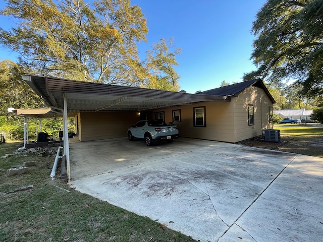 view of side of home featuring central AC unit and a carport